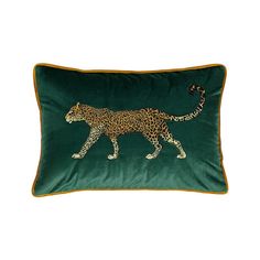 a green pillow with a leopard on it