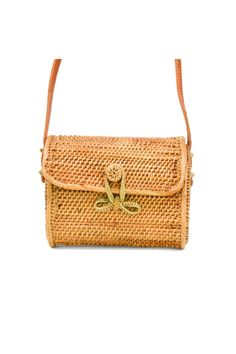 This is the sweetest mini-straw bag to complete a summertime look! The delicate bow closure and the careful woven details make this a truly special bag. Mini-messenger woven style with bow closure 6.5"W X 5.5"H X 3.25"D (*note - cannot fit an iPhone Plus size*) 100% Handwoven Rattan Fabric-lined interior Leather Strap Strap Drop: 15" Handmade by talented artisans Handmade Artisan Bags All of our rattan straw items are handwoven by individual artisans. Due to the fact that each rattan straw shoul Artisan Bag, Popular Handbags, Straw Handbags, Rattan Bag, Weave Style, Women Artisans, Vintage Handbags, Handmade Artisan, Online Bags