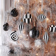 a decorated christmas tree with black and white ornaments