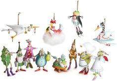 a group of figurines that are all dressed in different styles and colors, including clowns