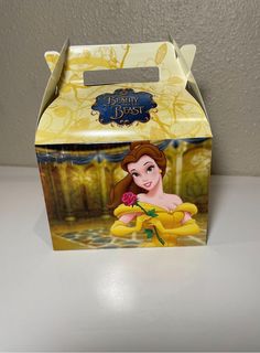 a cardboard box with an image of princess from beauty and the beast on it's lid