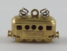 "This is a vintage \"Tram/Streetcar\" 18 karat gold charm for a charm bracelet.  It weighs 7.65 grams and measures 1\" x 5/8\", marked \"18K\" All charms come with a split ring to attach to a bracelet. We have hundreds of charms in stock. If you don't see what you are looking for in our shop please contact us as it is likely we have it. Inventory #G2885" Diamond Carat Size, Shiny Bracelets, Charm Accessories, Interesting Jewelry, Diamond Bracelet Design, Jewelry Staples, Classic Bracelets, Cable Car, Gold Charms