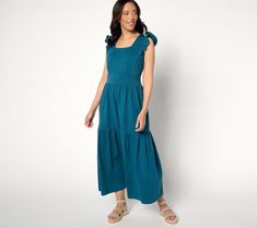 This maxi dress meets all your style goals for sunny season: cotton fabrication (with a bit of comfy stretch), elevated details (ruffles, shirring, and tiers -- oh my!), pockets, and dress up/dress down versatility. In it slides to your weekly rotation! From AnyBody®. Casual Tiered Cotton Midi Dress, Casual Cotton Tiered Midi Dress, Tiered Cotton Maxi Dress With Ruffle Hem, Casual Tiered Skirt Maxi Dress For Daywear, Solid Summer Cotton Maxi Dress, Solid Cotton Summer Maxi Dress, Casual Cotton Maxi Dress With Ruffle Hem, Casual Solid Color Maxi Dress With Ruffles, Casual Solid Cotton Maxi Dress