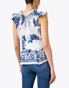 Loretta Caponi's Maria blouse is the epitome of Italian style and elegance. Crafted from crisp cotton, printed with a navy floral motif, intricately embroidered, and cinched with a self-tie belt, this smocked blouse is brimming with ladylike details. The intricate smocking along the neckline is elasticated, lending the option of an off-the-shoulder look for even more versatility. Wear yours with jeans and understated accessories for an instantly chic ensemble. Skirt And Top Dress, Smocked Blouse, Cotton Blouse, Navy Floral, Cotton Blouses, Italian Style, Tie Belt, Skirt Top, Floral Motif