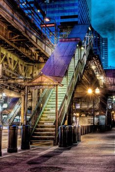 an image of stairs in the city at night