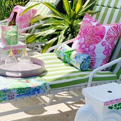 Palm Beach style pool patio. Green and white striped pool loungers with colorful pillows by Katie Herman Art. Pops of pink on the green patio chairs gives the perfect Palm Beach vibe. Palm Beach Pool Decor, Pink Patio Decor, Palm Beach Patio, Pool Patio Decor, Palm Beach Print, Cabana Decor, Palm Beach Decor, Poolside Decor, Green Pool