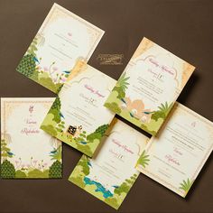 the wedding stationery is laid out on top of each other