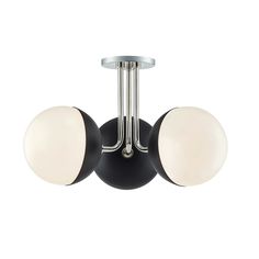 two lights are mounted on the wall in this modern light fixture, which is black and chrome