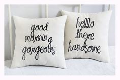 two white pillows with black lettering on them, one says good morning and the other says goodbye