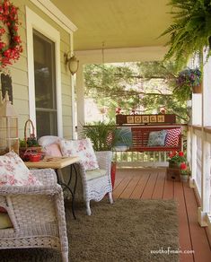 two wicker chairs sitting on the front porch