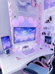 a white desk with two computer monitors and a keyboard on it in front of a pink flowered wall