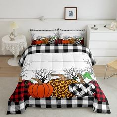 the bed is decorated with buffalo, pumpkins and leopard