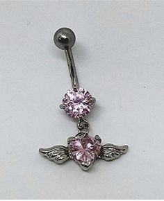 a pink belly piercing with angel wings and heart shaped crystal stones on the end of it