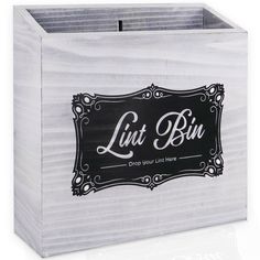 a white wooden box with a black and white label on the lid that says lui bin