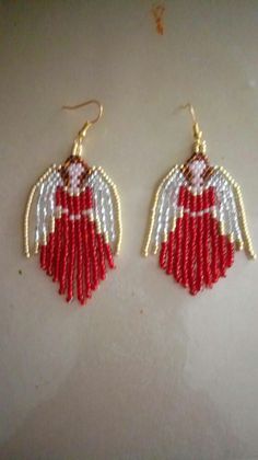 red and white beaded earrings with angel wings