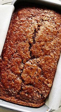 a loaf of bread sitting in a pan on top of a table