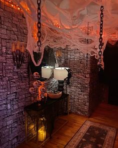 a room decorated for halloween with lights and decorations