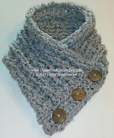 a crocheted cowl with buttons on it