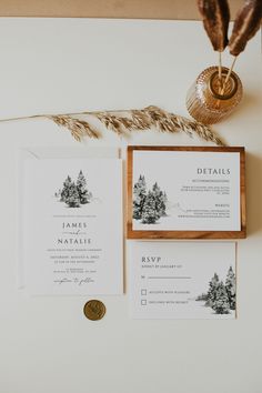 the wedding stationery was done in black and white, with pine trees printed on them