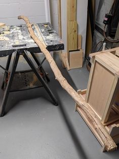 a table that has been made out of wood and is being used as a workbench