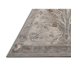 an area rug with a tree design on the top and bottom, in grey tones