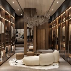 an elegant walk in closet with chandelier and furniture