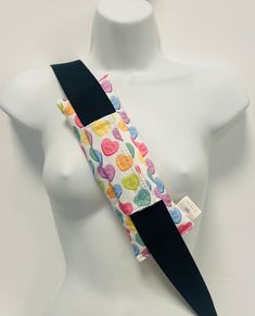 a white mannequin wearing a colorful tie on it's neck