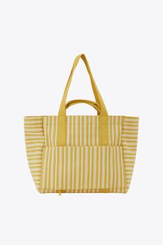 Designed to go straight from your flight to the beach, this is the ultimate summer tote bag. It’s truly the best of both worlds with a chic, yarn-dyed custom stripe design inspired by summers in Europe, plus an interior packed with all of our 5-star functional features. Open this timeless tote to find a wipeable lining, organized slip pockets, and interior water bottle holders. Easy to carry (thanks, removable crossbody strap), perfect for styling, and made from durable recycled cotton, we’d boo Striped Double Handle Shoulder Bag For Travel, Striped Rectangular Shoulder Bag For Travel, White Travel Bag With Striped Lining, Travel Tote Shoulder Bag With Striped Lining, Striped Canvas Shoulder Bag For Daily Use, Everyday Bags With Striped Lining And Double Handle, Striped Travel Tote Shoulder Bag, Striped Beach Bag For Everyday Summer Use, Striped Travel Bags For Summer