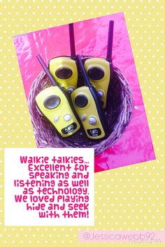 there are four yellow radio remotes in a basket with pink polka dots on it