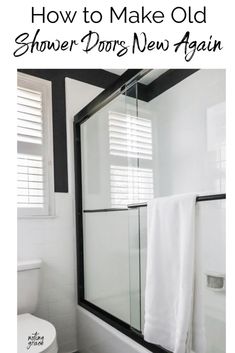 a white bathroom with black and white tile on the floor, shower doors new again