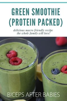 two glasses filled with green smoothie and raspberries