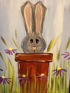 a painting of a rabbit sitting on top of a box with daisies in the background