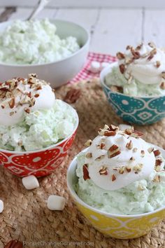 three bowls filled with ice cream on top of a table