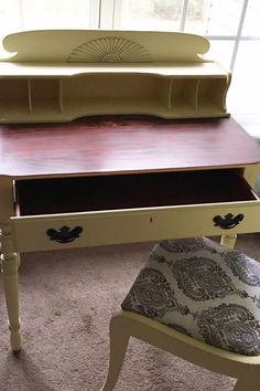 a desk with a bench on top of it