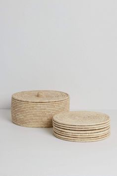 four round baskets stacked on top of each other