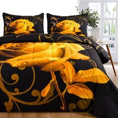 a bed with yellow roses on it and black comforter set in front of a window