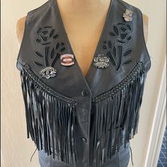 I Am Selling A Beautiful Black Fringed Leather Women’s Bikers Vest, Size Medium, By Usa Bikers Dream Apparel. It Is A Very Soft Leather, With Black Suede Cutout Roses. It Comes Complete With Five Harley Davidson Pins, Two Brand New Packages Of Pin Savers, And Two Harley Davidson Collectible Model Motorcycle. Harley Davidson Accessories, Biker Vest, Motorcycle Model, Black Fringe, Black Suede, Soft Leather, Leather Women, Harley Davidson, Jackets & Coats