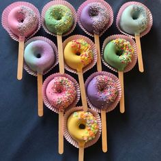 there are many doughnuts on the sticks with sprinkles in them