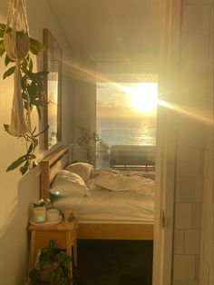 the sun shines brightly through an open door into a bedroom