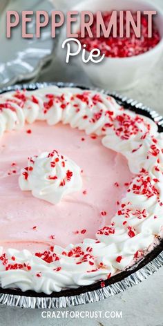 peppermint pie with whipped cream and red sprinkles in the crust