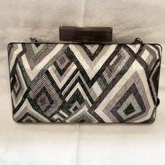 This Geometric Print Evening Bag, Converts From A Clutch To A Mini Shoulder Bag, With Either A Chain Or Silk Rope Strap. Grey Pearlized Snap Closure, Finishes The Look. It May Be One Of A Kind Since It's A Sample. Formal Metallic Silver Rectangular Bag, Metallic Silver Rectangular Shoulder Bag For Formal Occasions, Metallic Silver Rectangular Shoulder Bag For Formal Events, Formal Metallic Silver Rectangular Shoulder Bag, Elegant Metallic Silver Rectangular Shoulder Bag, Chic Silver Clutch With Silver-tone Hardware, Modern Party Clutch With Silver-tone Hardware, Modern Silver Party Bags, Silver Clutch With Silver-tone Hardware For Events