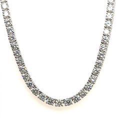 Stunning Modern 18k White Gold Natural 11.29 Carat Round Brilliant Diamond Tennis Necklace, approximately 2.7mm diameter, G-H in color and VS-SI1 in clarity.  The piece is set with 140 diamonds and is 16.5" inches in length and weighs 20 grams. Dazzling Round Cut Diamond Necklace, White Gold Tennis Necklace With Diamond Cut Lab-grown Diamonds, Dazzling Diamond Tennis Necklace With Prong Setting, Gift Tennis Necklace With Single Cut Diamonds, Diamond White Diamond Tennis Necklace, Dazzling Diamond White Round Cut Tennis Necklace, White Gold Brilliant Cut Tennis Necklace, White Gold Tennis Necklace With Brilliant Cut, Luxury Round Cubic Zirconia Diamond Necklace