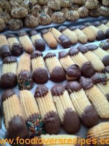 chocolate covered cookies are arranged in rows on a tray