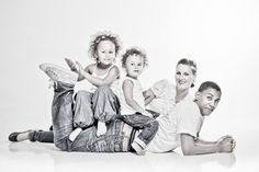 a family poses for a black and white photo