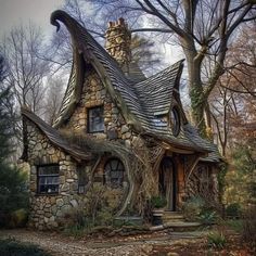 a house made out of rocks and vines