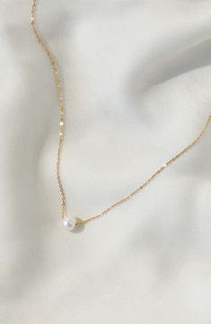 A single freshwater pearl makes a simple yet stunning statement on this delicate chain necklace. 16" length Pearl size: 8mm 14k-gold fill/freshwater pearl Made in the USA Gold Pearl Accessories, Simple Pearl Jewelry, Pearl Gold Jewellery, Pearl And Gold Necklace, Simple Pearl Necklace, Peacock Pearl, Simple Pearl, Gold Pearl Necklace, Freshwater Pearl Necklaces