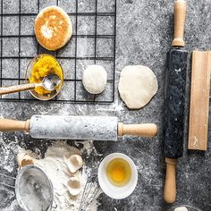 the ingredients for making cookies are laid out on top of the table, including doughnuts and butter