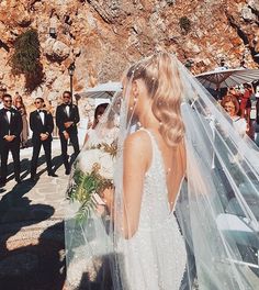 the bride and groom are getting ready to walk down the aisle at their wedding ceremony