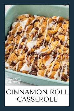 cinnamon roll casserole with icing drizzled on top in a blue dish