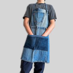 a man wearing an apron and denim overalls